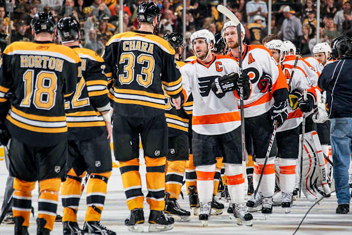 After battering one another, hockey players have a standing tradition in the playoffs: Put 'er there, and put it behind you.